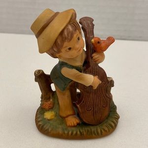 Vintage Napco figurine, porcelain boy, playing cello with little bird on hand